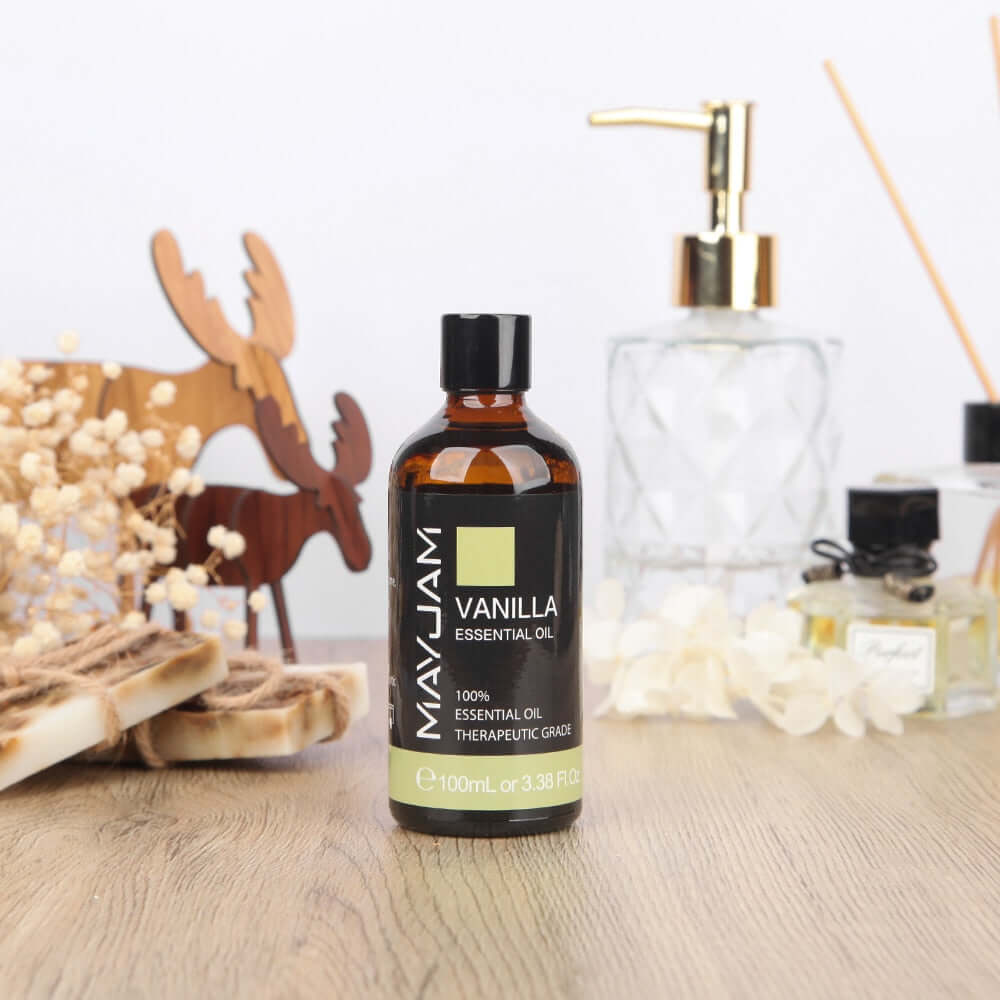 100ml Premium Vanilla Essential Oil bottle surrounded by decorative elements, perfect for aromatherapy and fragrance.